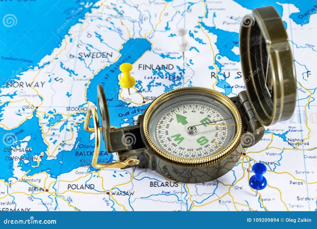 exploration global travel - Magnetic Compass on a World Map Conceptual of Global Travel